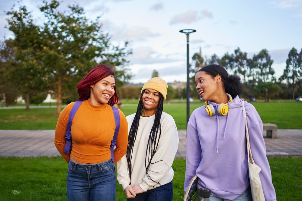 20230411-061253three-students-chatting-while-walking-along-the-ca-2022-12-15-01-09-50-utc